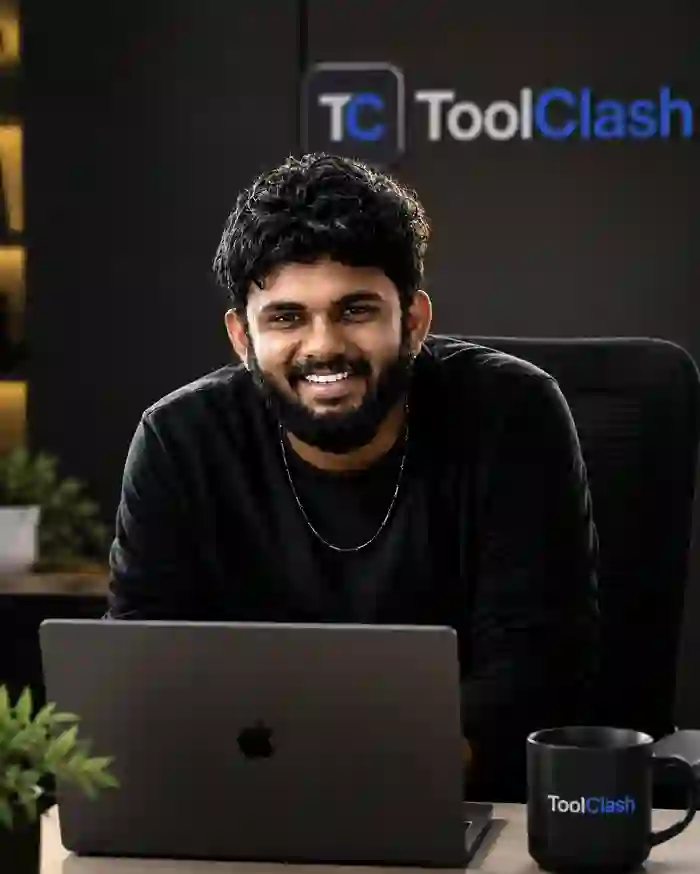 Leela at desk with laptop and ToolClash branding